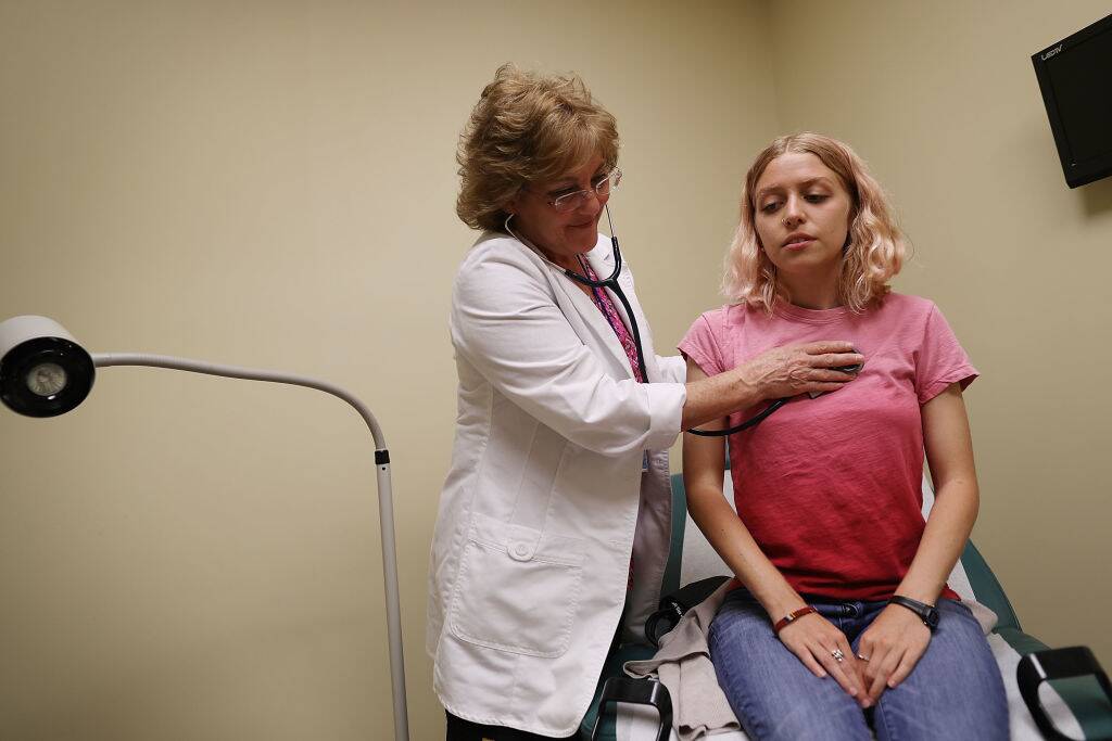 woman getting a checkup at the doctor