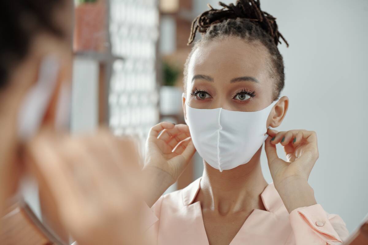 woman wearing a surgical mask