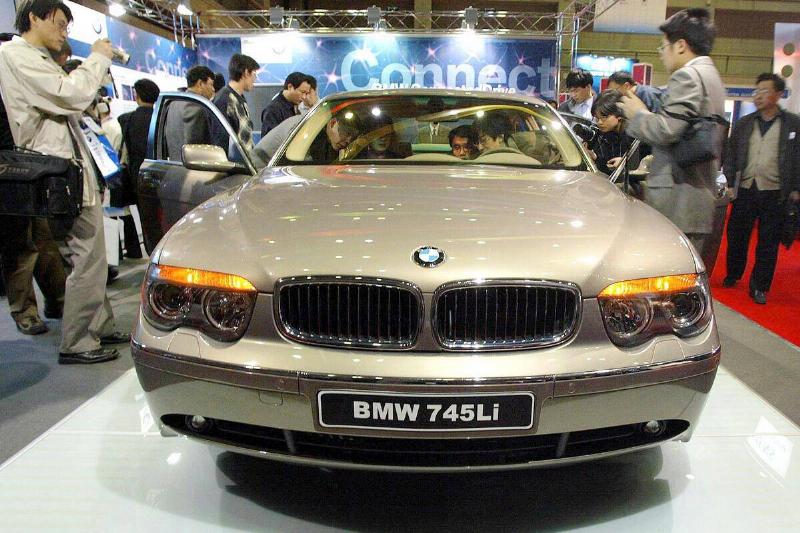 Potential car-buyers gather around BMW's latest mo