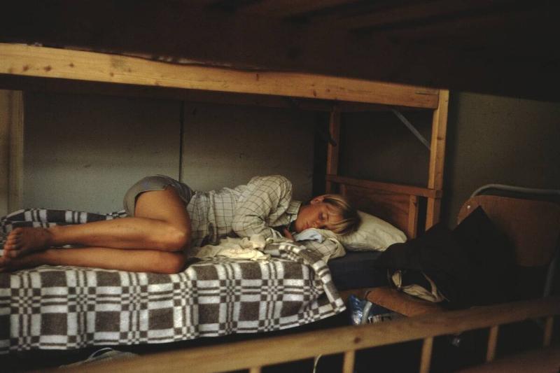 Woman Sleeping In Bunk Bed