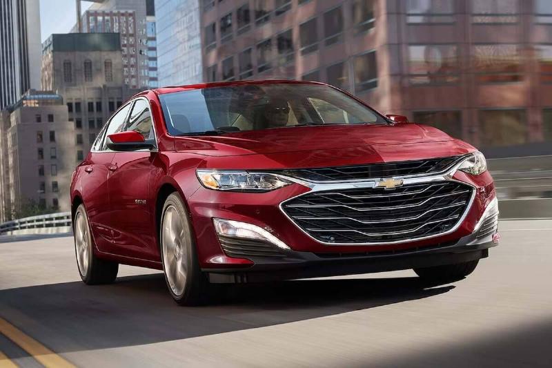 2024-chevrolet-malibu-front-view-driving-carbuzz-1139351-1600