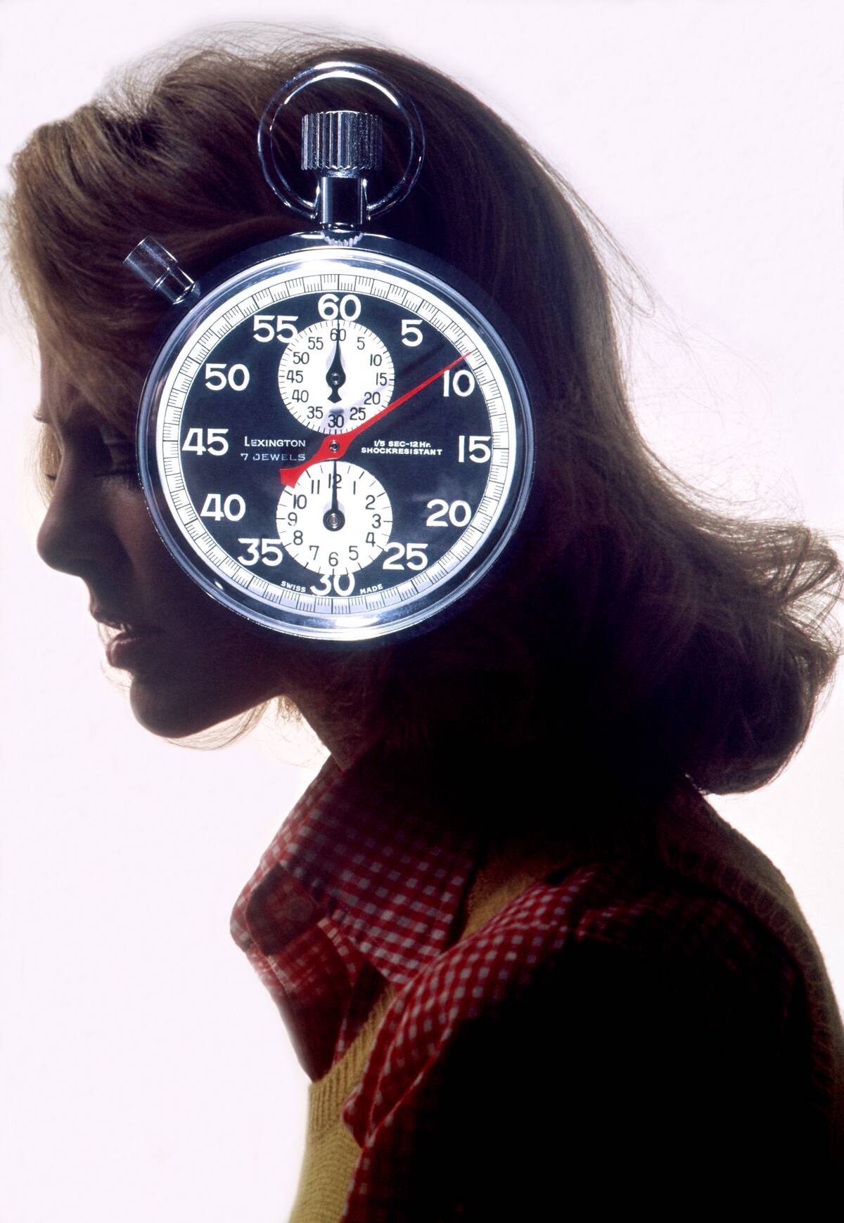 Anxious Woman With Stopwatch On Her Mind in the 1970's