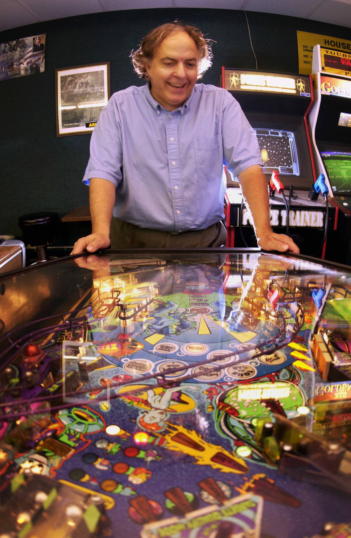 WEDNESDAY_06/26/02_Hopkins - - - - - - Lloyd Olson loves to show off some of his more exotic pinball machines, like this 1996 Capcom called 