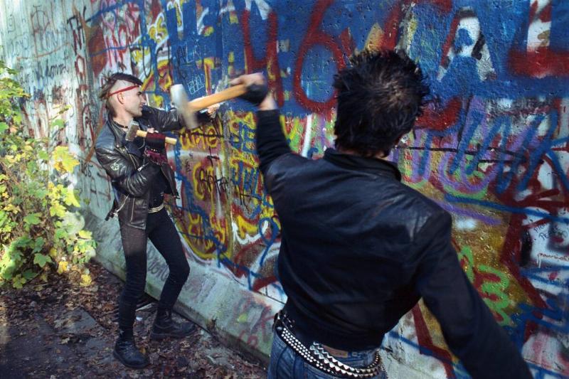 Youths Chipping Away at Berlin Wall