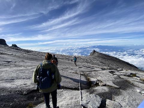 People climbing Mount Kinabalu.