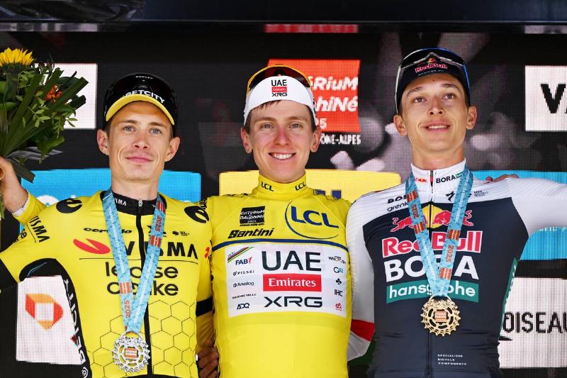 (L-R) Jonas Vingegaard of Denmark and Team Visma | Lease a Bike on second place, race winner Tadej Pogacar of Slovenia and UAE Team Emirates - XRG - Yellow leader jersey and Florian Lipowitz of Germany and Team Red Bull - BORA - hansgrohe on third place pose on the podium ceremony after the 77th Criterium du Dauphine 2025, Stage 8.