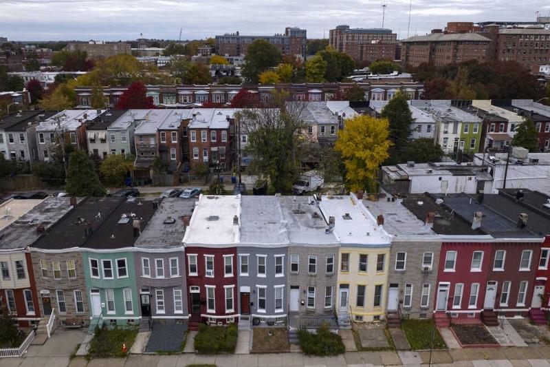Aerial view of rows of brightly covered row houses of Northern Baltimore