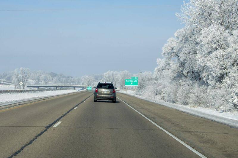 Car going down Interstate 35 after a fresh snowfall