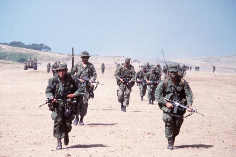 Combat Soldiers Run Across Field