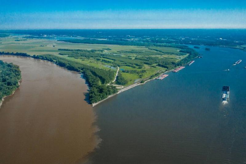 Confluence of Missouri. (left) and Mississippi (Right) rivers near St. Louis Mo. and Alton, Illinois view from Drone shows barges