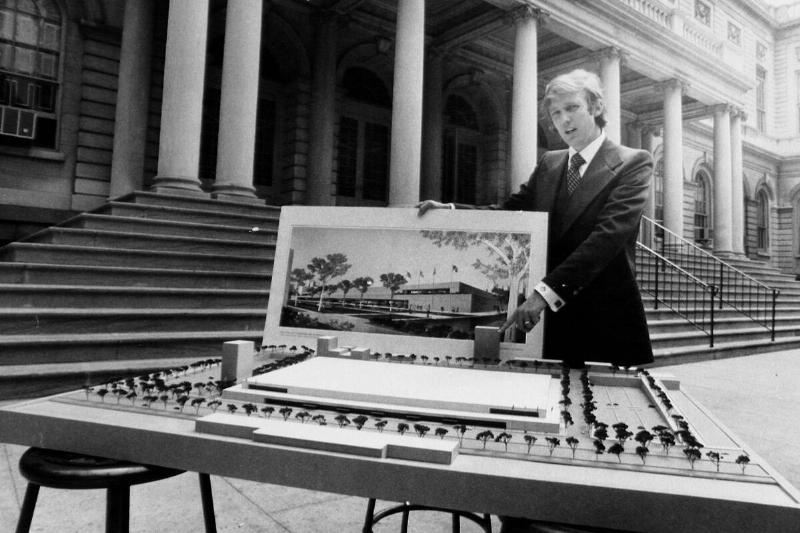 Donald Trump stands behind architect's model of City Hall Pl