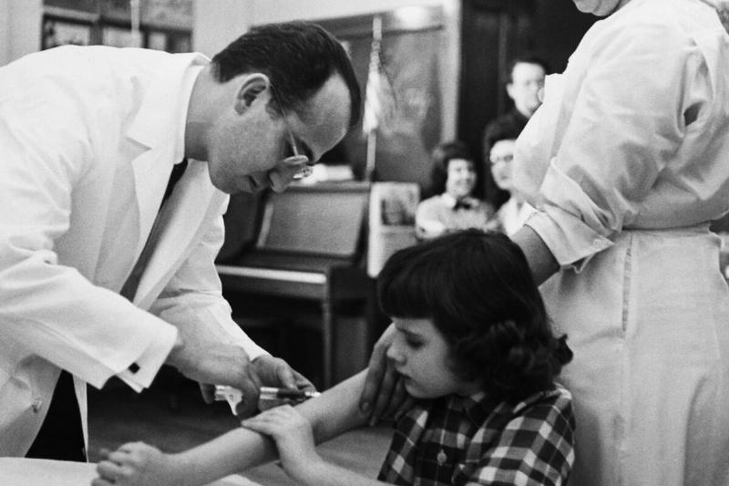 Jonas Salk Giving Girl Vaccination Shot