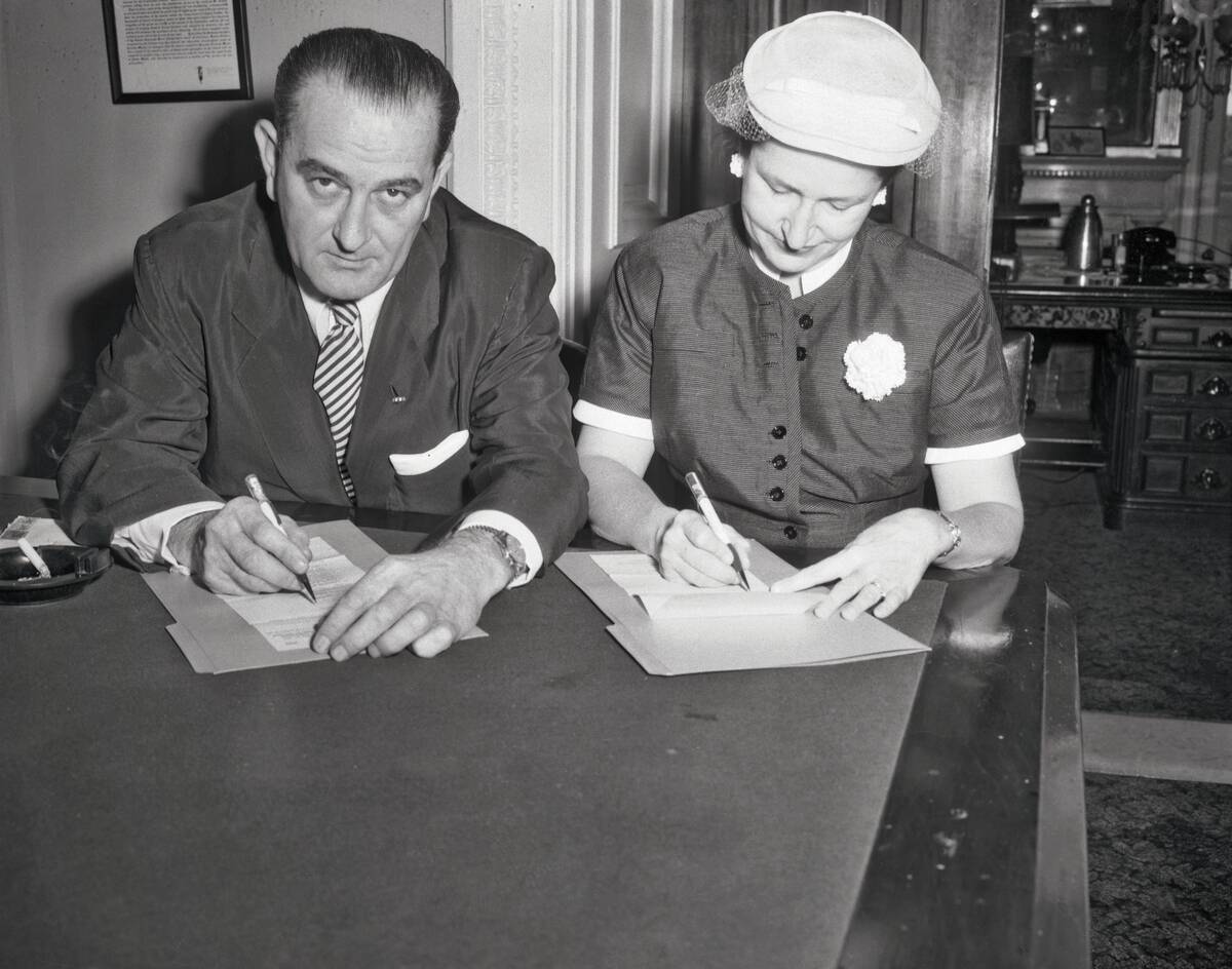 Lyndon Johnson and Wife Marking Absentee Ballots