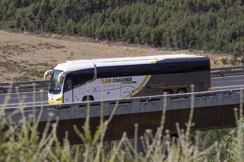 Paarl, Western Cape, South Africa, Bus travelling along Hugos River viaduct on the N1 highway Huguenot Plaza toll road