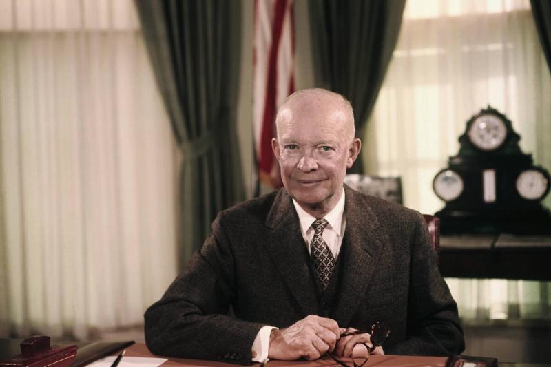 President Eisenhower Sitting at Desk in Oval Office