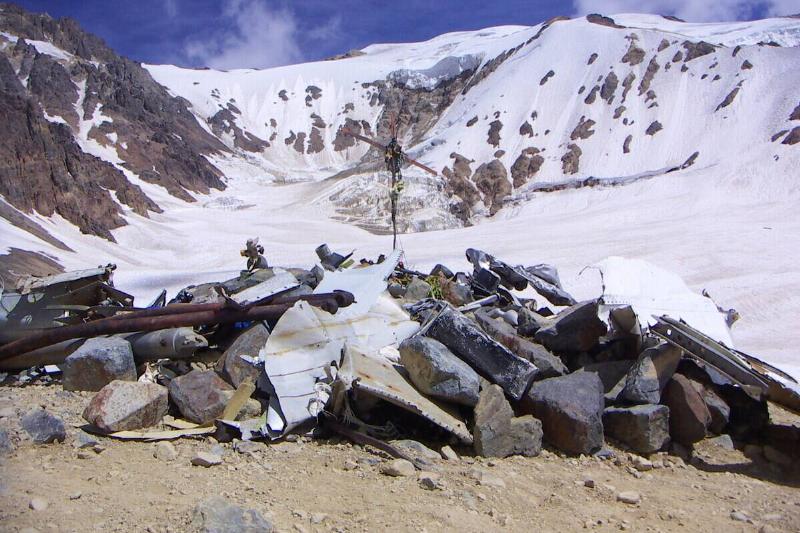 View of the Crash Memorial in February 2006. In the distance behind the Memorial is the mountain that Parrado and Canessa climbed for the final push to reach rescue.