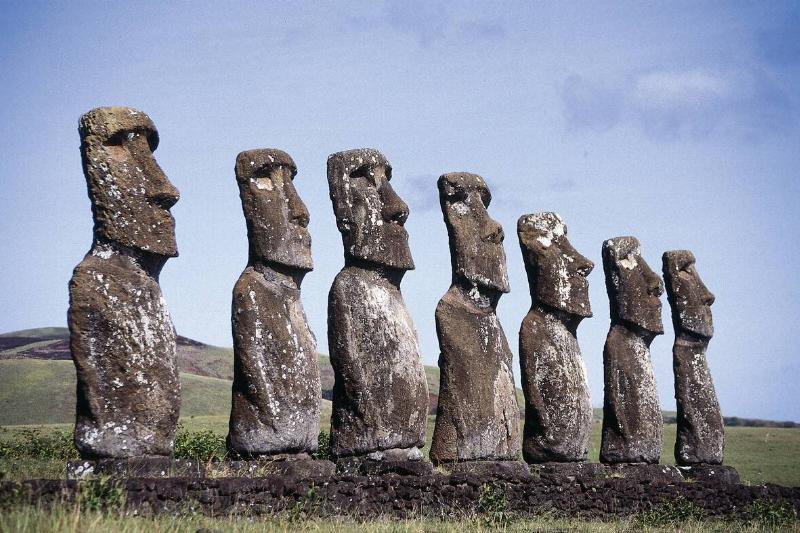 Seven stone Moai statues facing the sea at Ahu Akivi