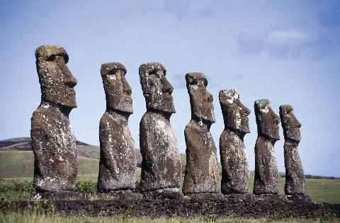 Seven stone Moai statues facing the sea at Ahu Akivi