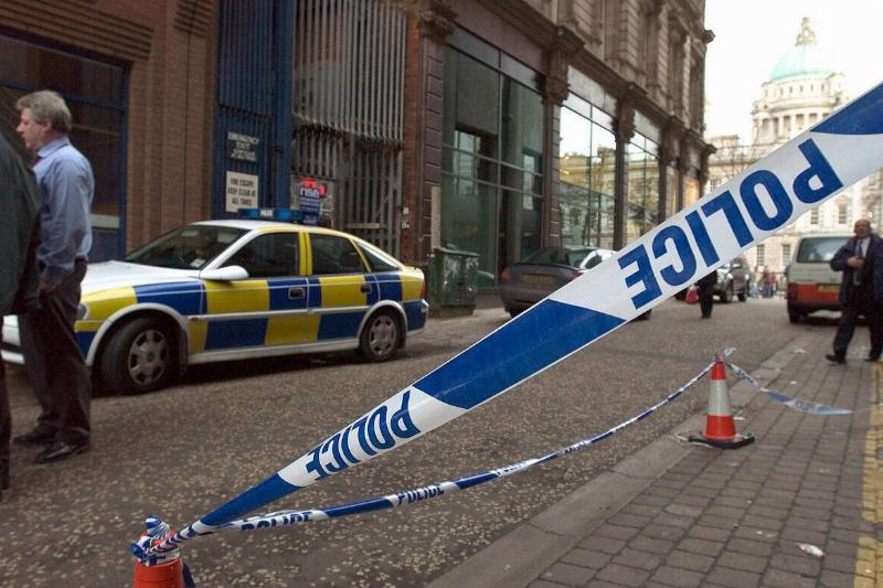 A police line tapes off the side of the