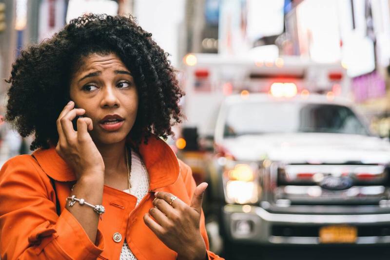 Woman on the phone with 911. 