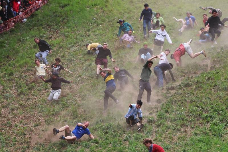 Annual Cooper's Hill Cheese-Rolling Event Takes Place In Gloucester