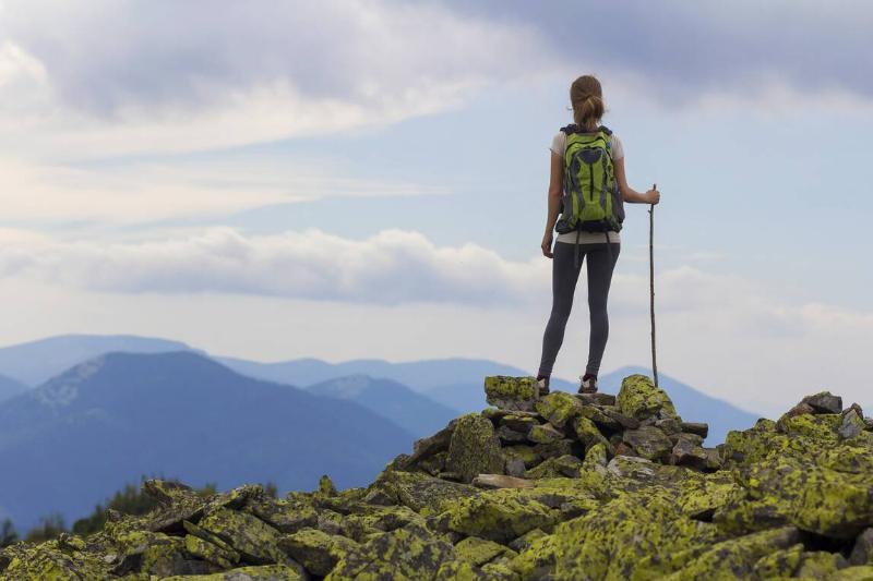 Hiker on top of rock. 