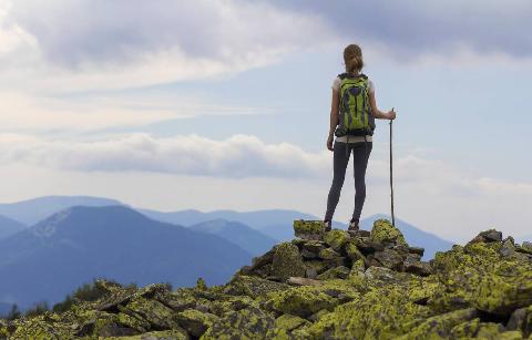 Hiker on top of rock. 