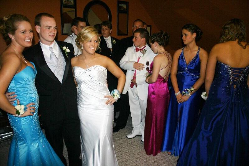 Before the South Portland prom, Liza DeCesare, Chris Foster and Esther Palmieri smile for the camera