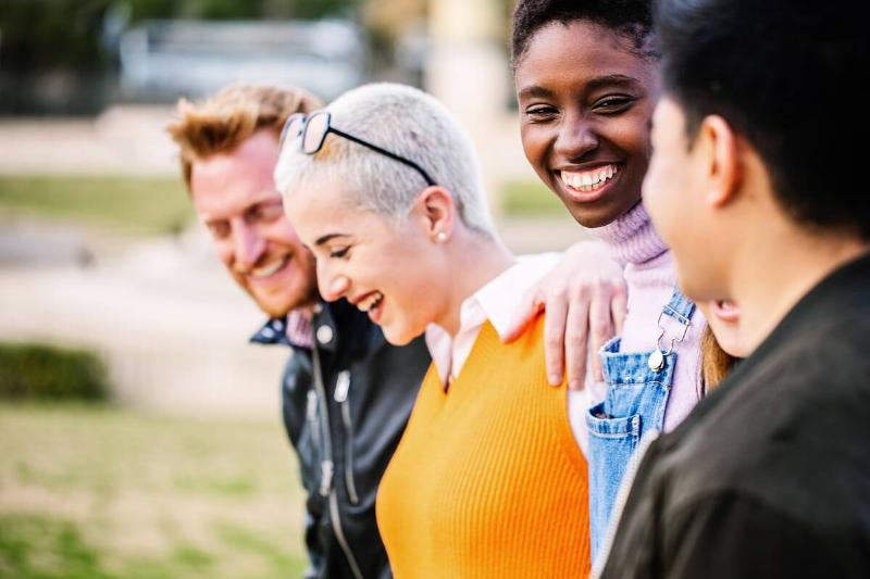 Group of young people having fun together outdoors. 