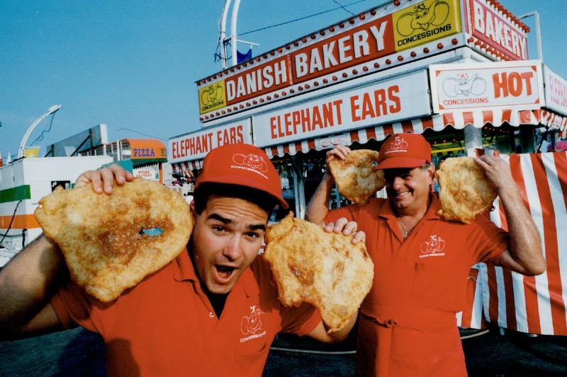 Dough boys: Shaun Fuller; left; and Fred Klemme lend an (elephant) ear outside their booth selling t...