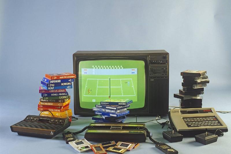 Home video games in the 1980s. A selection of the most popular game entertainment products in front of...