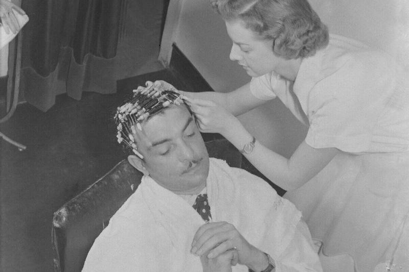 Mr Raymond, a hair stylist, has a new poodle cut