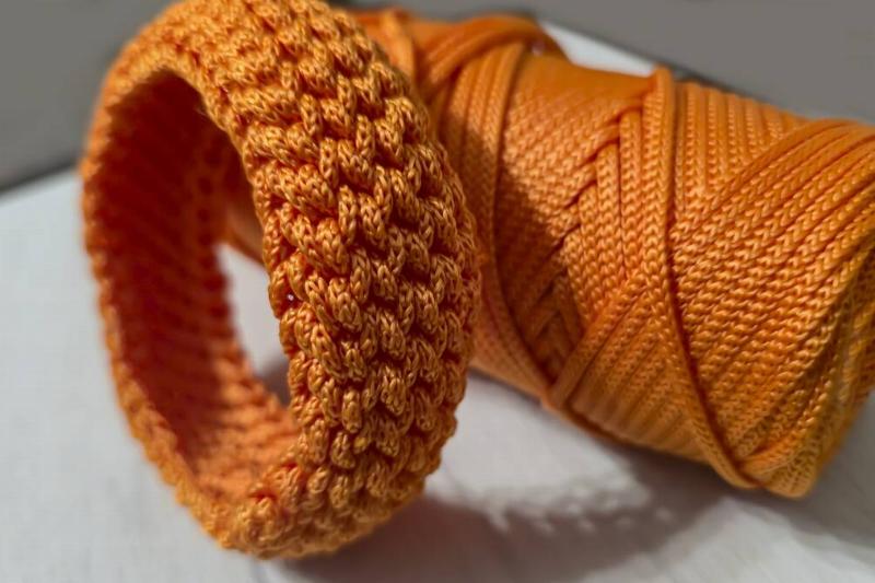 Orange paracord made into a bracelet. 