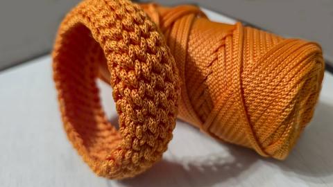 Orange paracord made into a bracelet. 