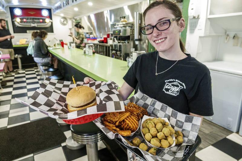 Palatka, Florida, Angel's Dining Car, oldest diner in state, food server with platters of food