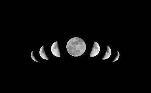 Various phases of the moon visible in the night sky.