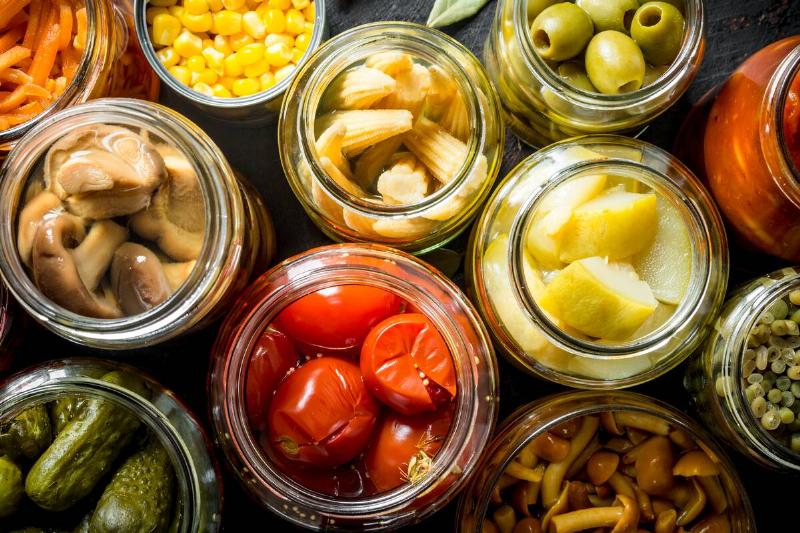 Preserved vegetables in glass jars.