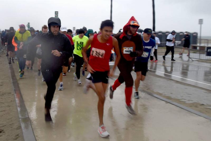 Rain or shine proved very wet for runners of the Long Beach Turkey Trot