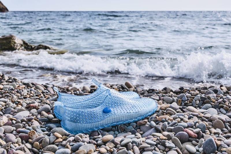 Swim shoes by water. 