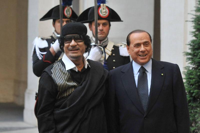Silvio Berlusconi, Italy's prime minister, left, poses for p