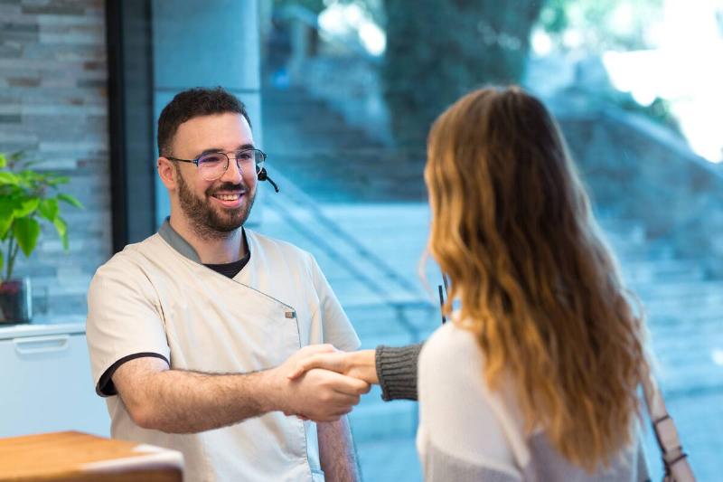 Two people shaking hands.