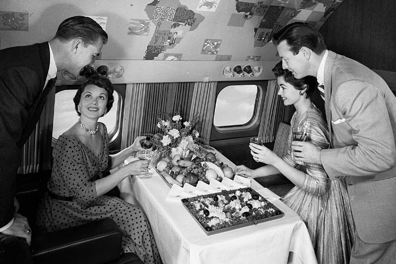 Some People Serve Themselves From A Buffet On An Aeroplane