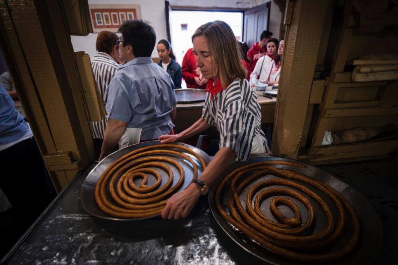 SPAIN-SANFERMIN-FESTIVAL-CHURROS