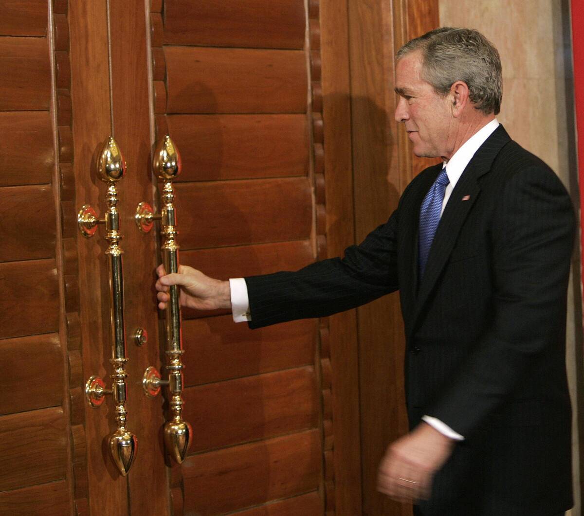US President George W. Bush approaches a