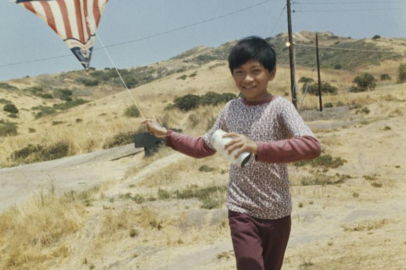 Vietnamese Boy Flying A Kite