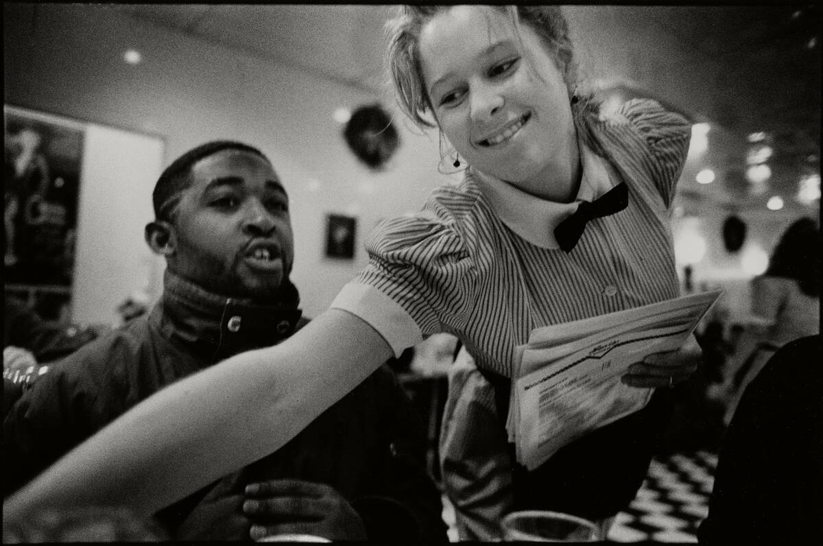 Waitress Serves Customers At Lori's Diner