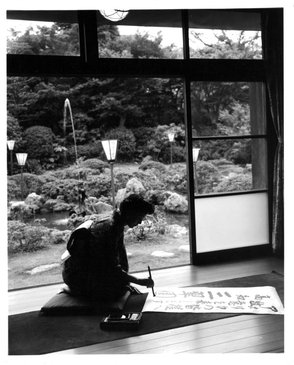 Woman Painting Calligraphy In Japan