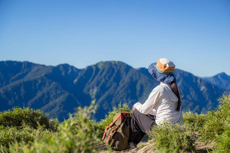 Woman relax during a mountain hike.