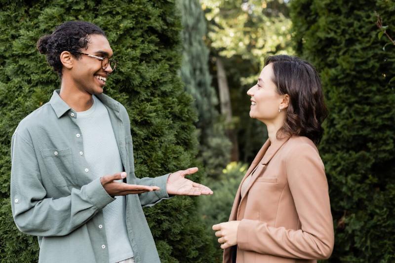 Man and woman talking.