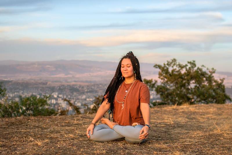 Woman doing yoga outside. 